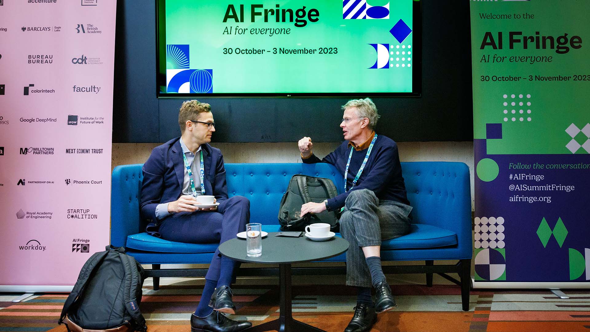 People in conversation at the AI Fringe