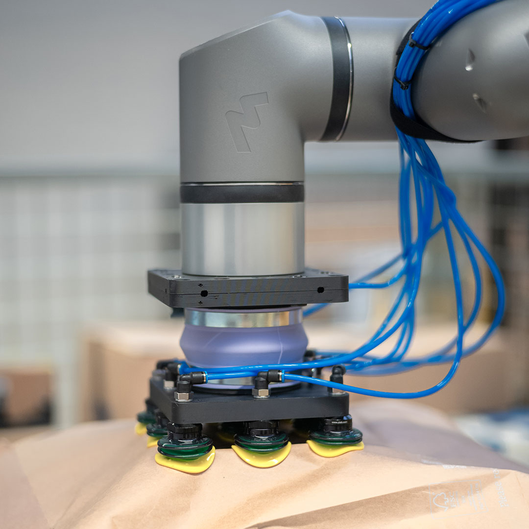 Flink logo debossed onto a robotic arm and gripper