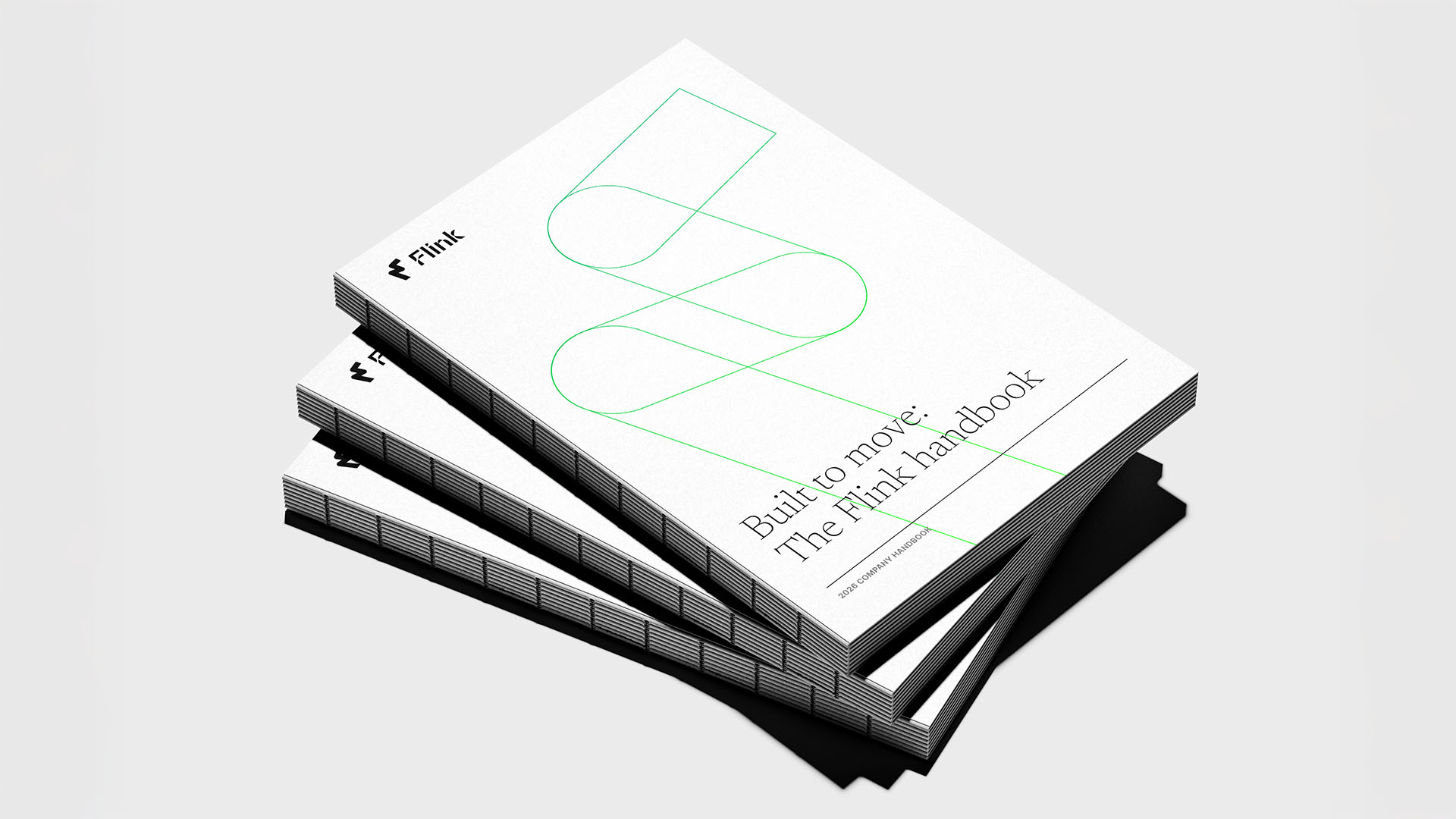 Three Flink Robotics company handbooks stacked on top of each other