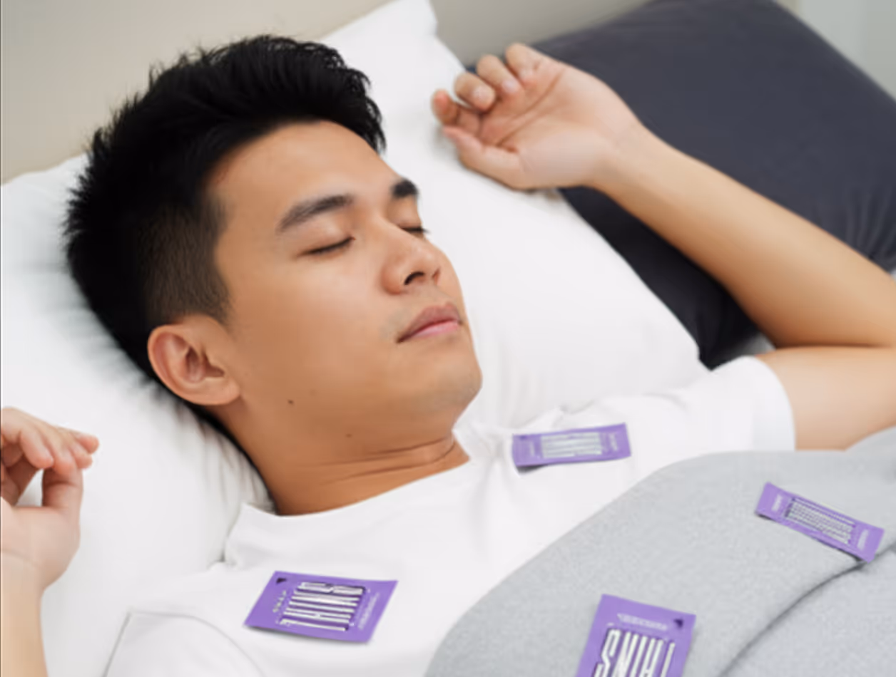 A sleeping Singaporean man wearing an sleep mask