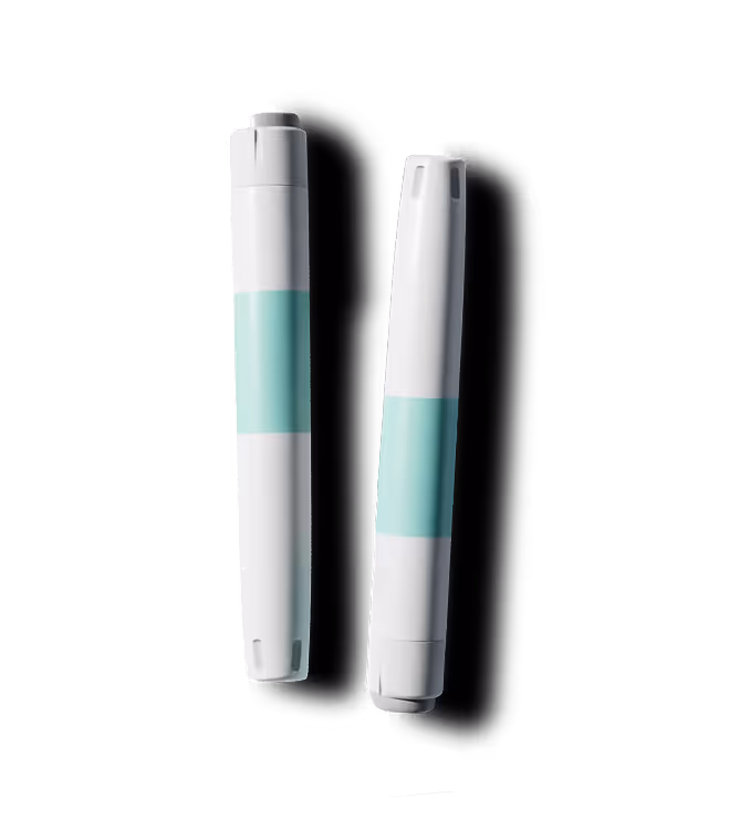 Two white medical pens with teal bands, shown vertically side by side.