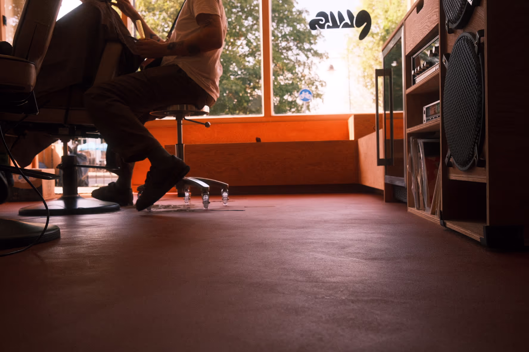A low to the ground photo of Plug London's Nunhead hair salon, facing the glass shop front. 