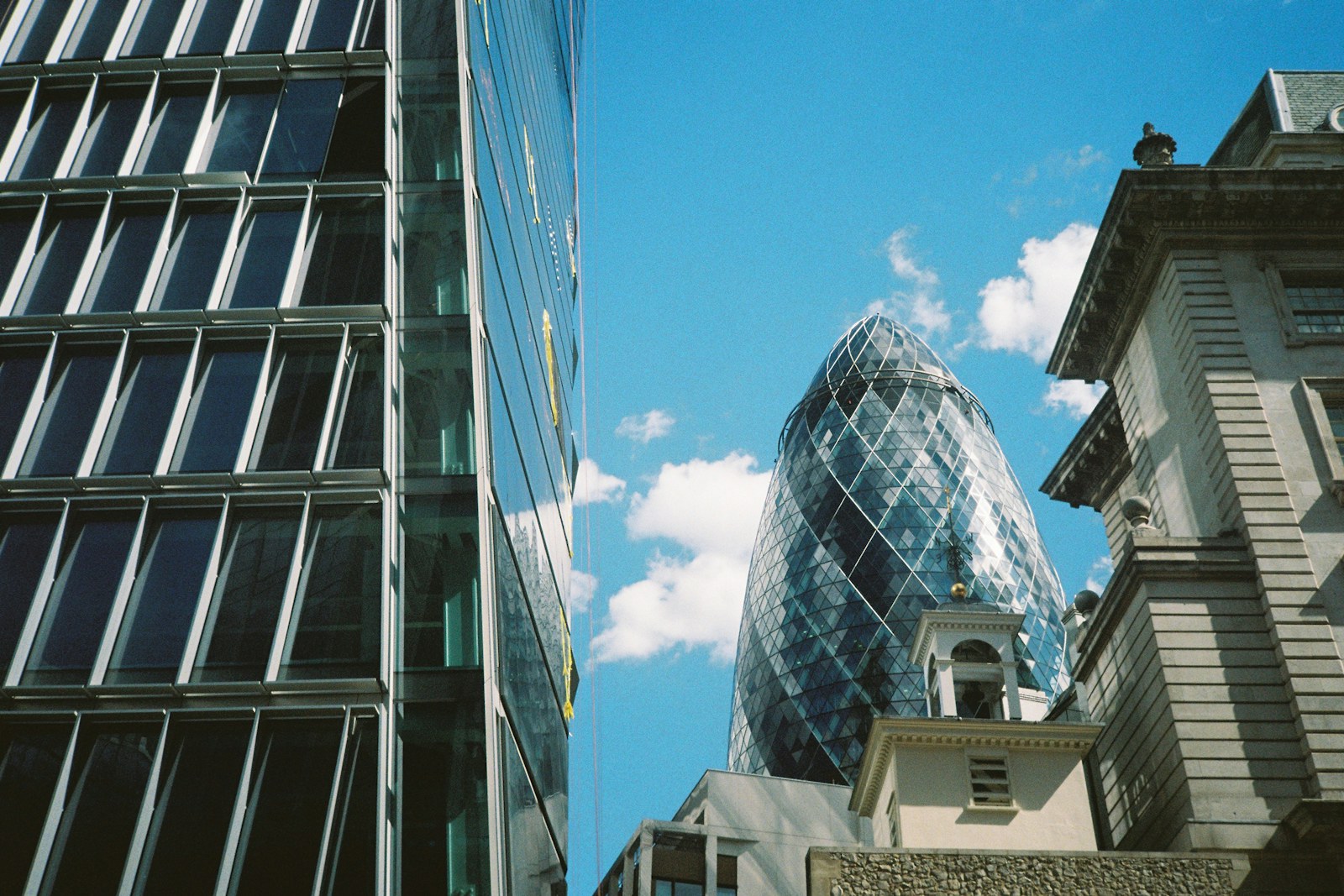 London office buildings and skyline under a blue sky