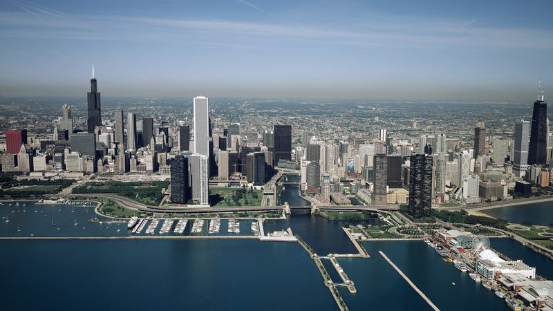 Aerial view of the Chicago skyline and lakefront, a dense commercial building portfolio