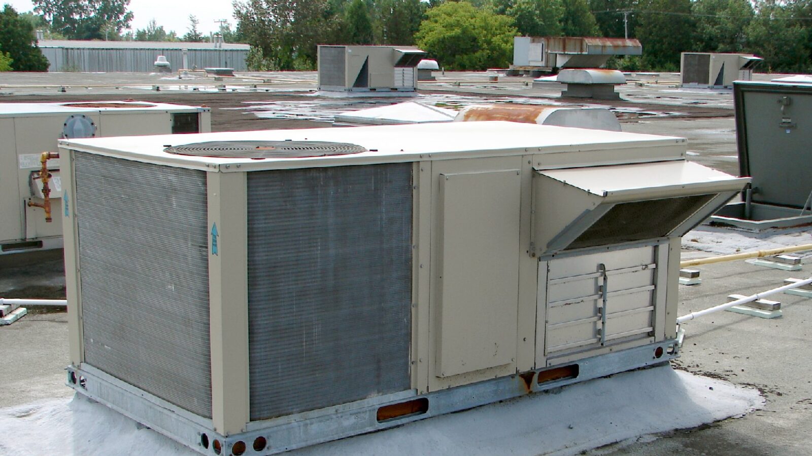 Rooftop packaged air conditioning units on a commercial building roof