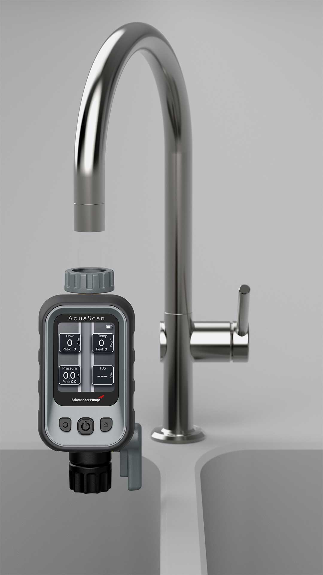 AquaScan digital water monitoring device attached to a silver kitchen faucet over a dual sink, displaying flow, temperature, pressure, and TDS on its screen.