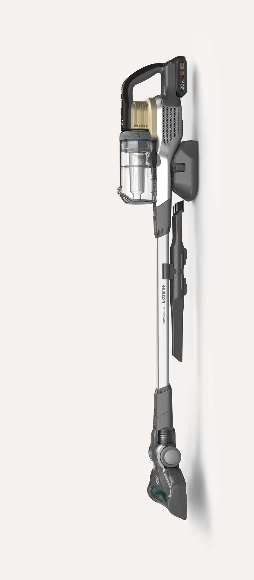 Cordless stick vacuum cleaner mounted on a wall dock with transparent dustbin, digital display on the battery, and a slim tube labeled 'Power Series Extreme'.