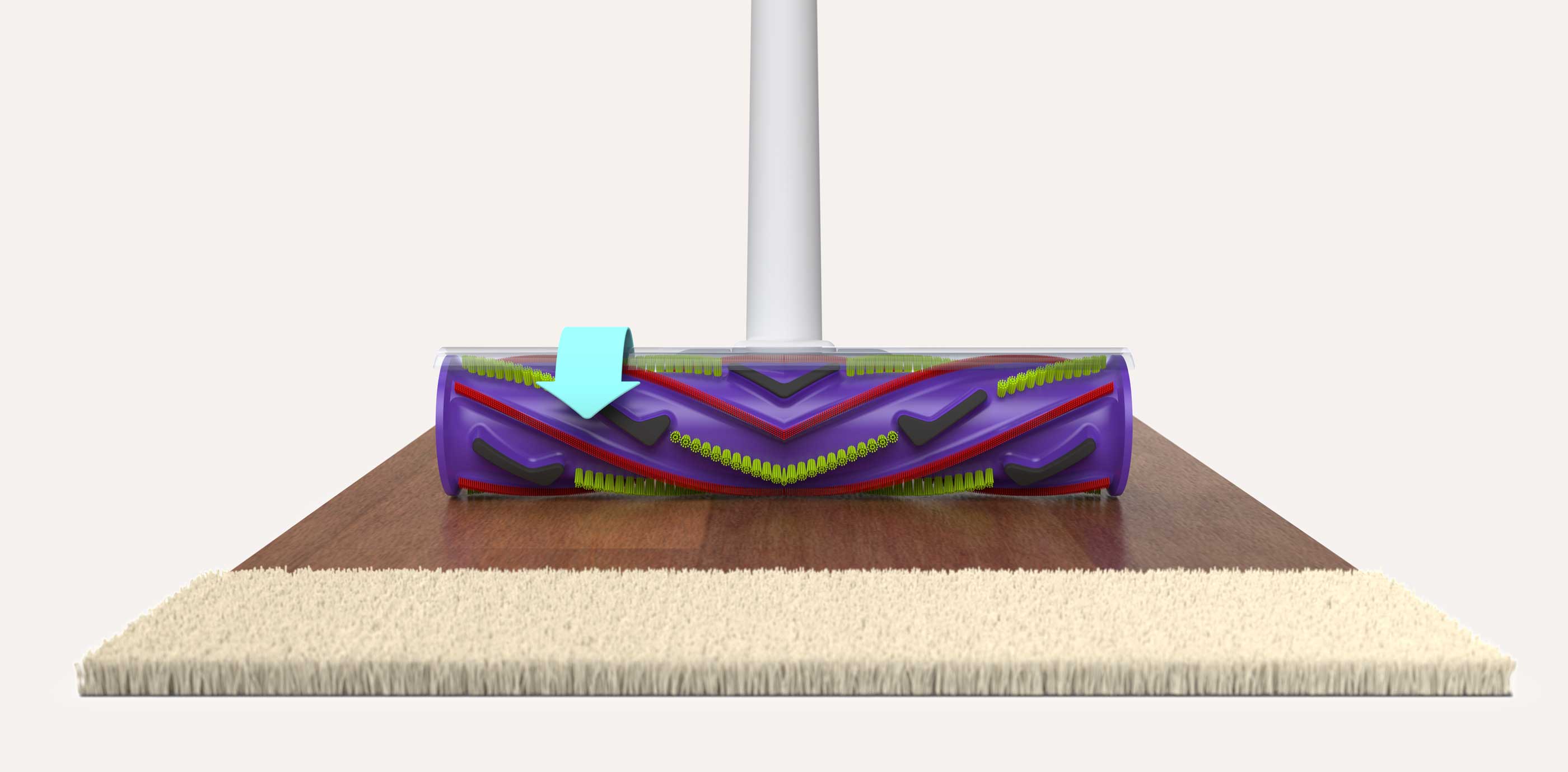 Close-up of a vacuum cleaner brush roll with purple, red, and green bristles positioned over a surface transitioning from carpet to hardwood floor.