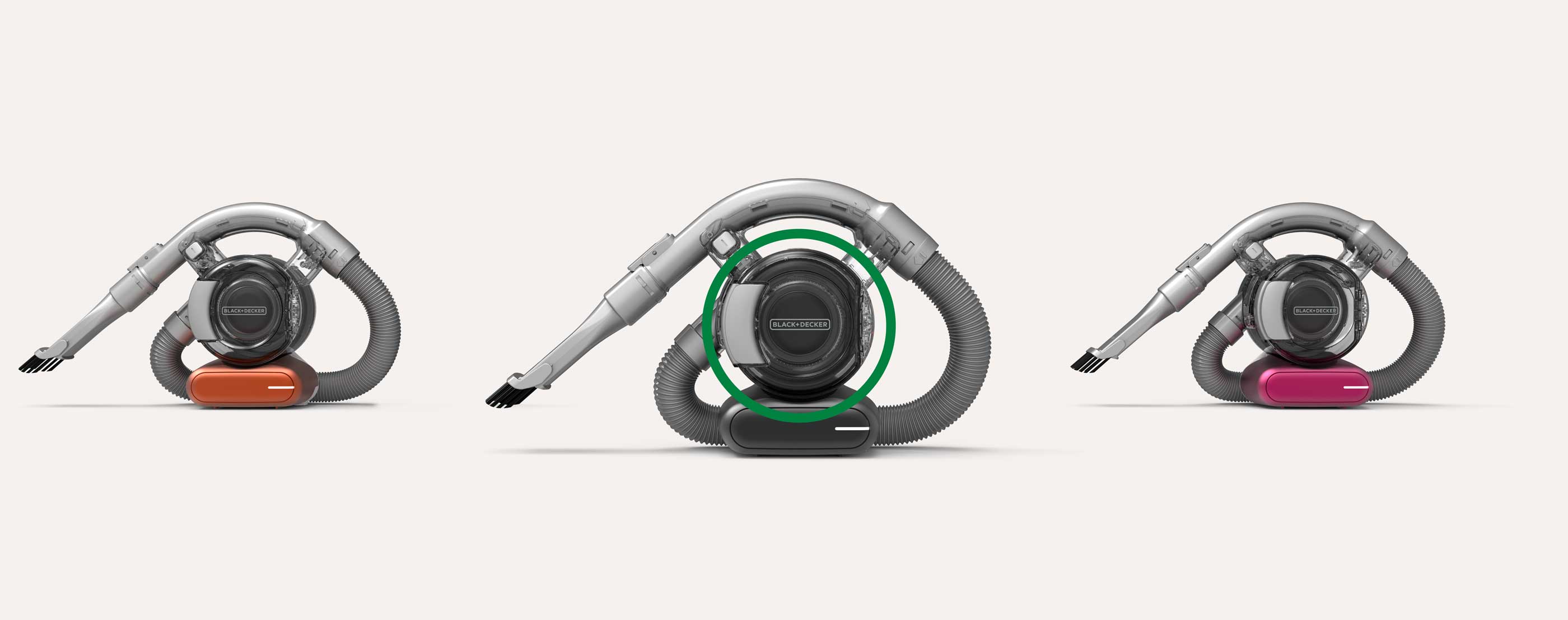 Three BLACK+DECKER handheld vacuum dustbusters in a row, each with different colored bases: orange, black, and pink, connected to flexible hoses and nozzle attachments.