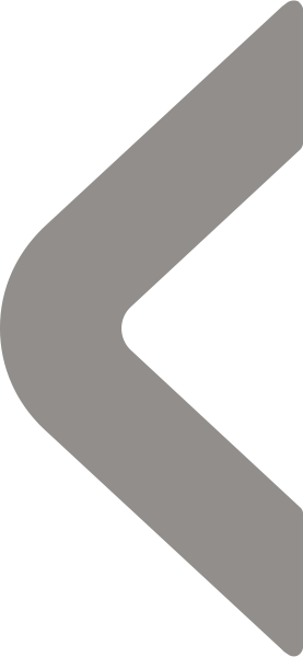 Gray left-pointing arrow with rounded edges on a white background.