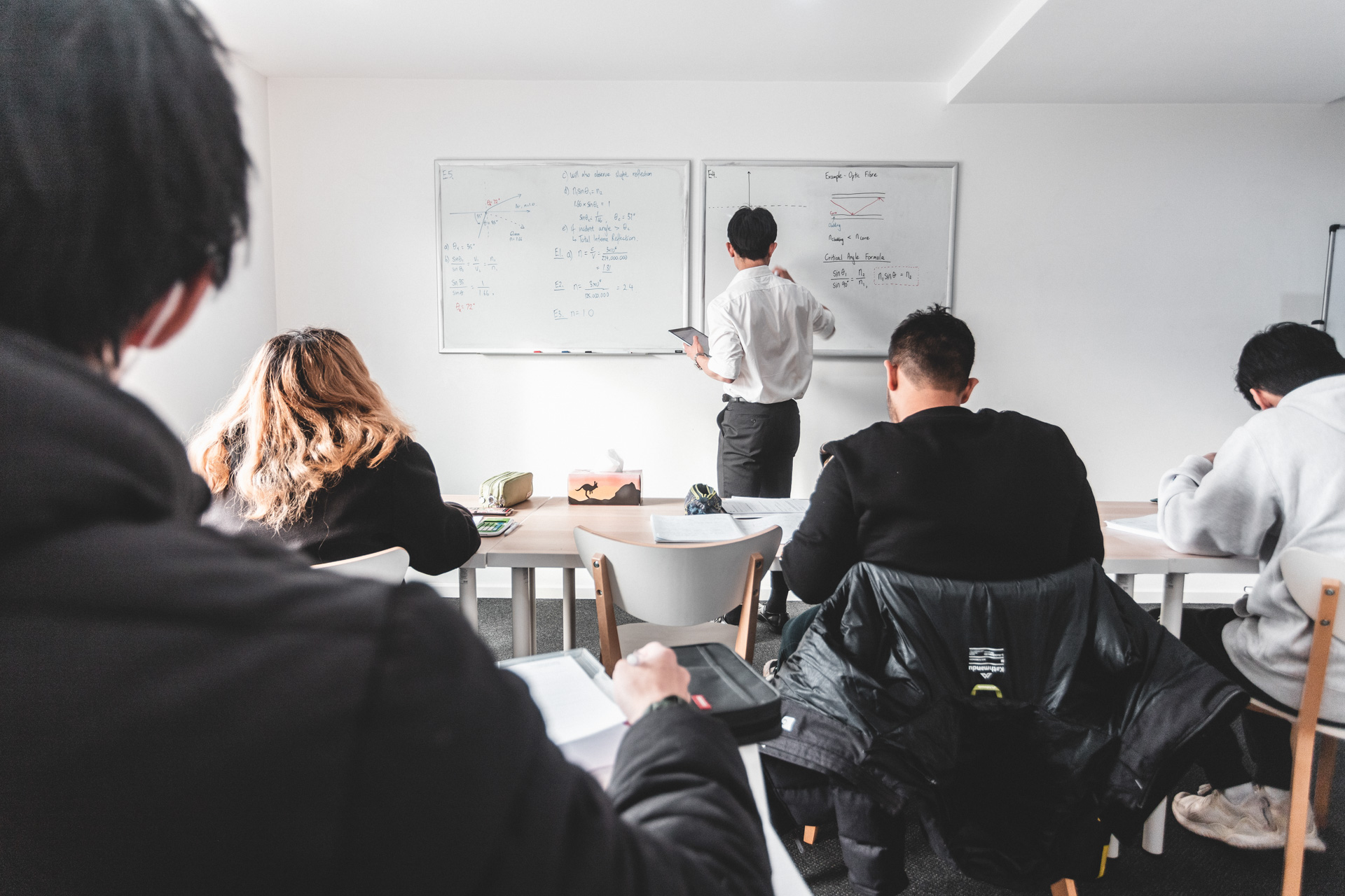A VCE Physics Tuition Class with tutor at the front of the room