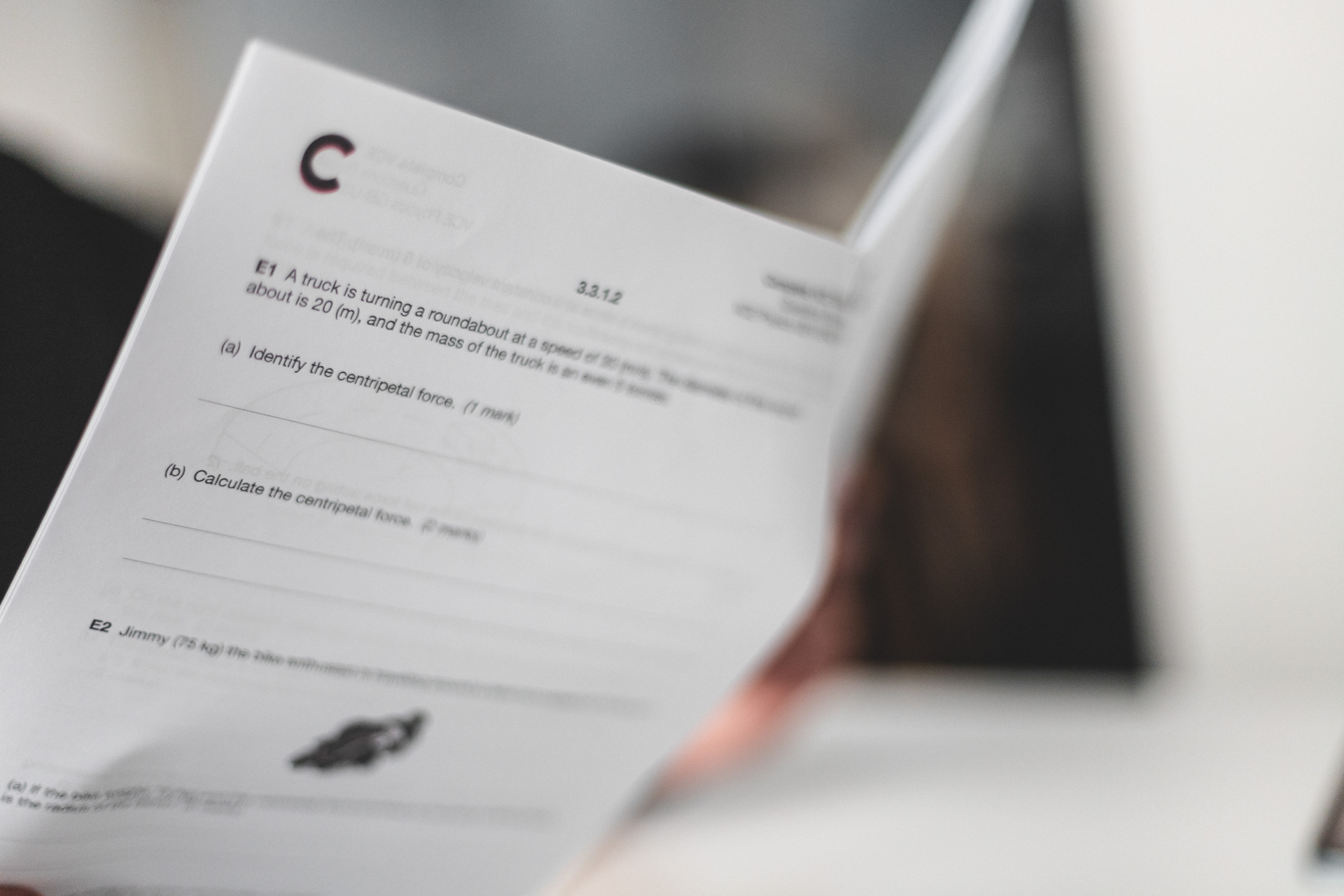 Two-page math exam with a blue graph showing a hill function and sight lines labeled 'can be seen' in green and 'can't be seen' in red from the origin, and questions about mining iron profit calculations in a VCE Math Methods style