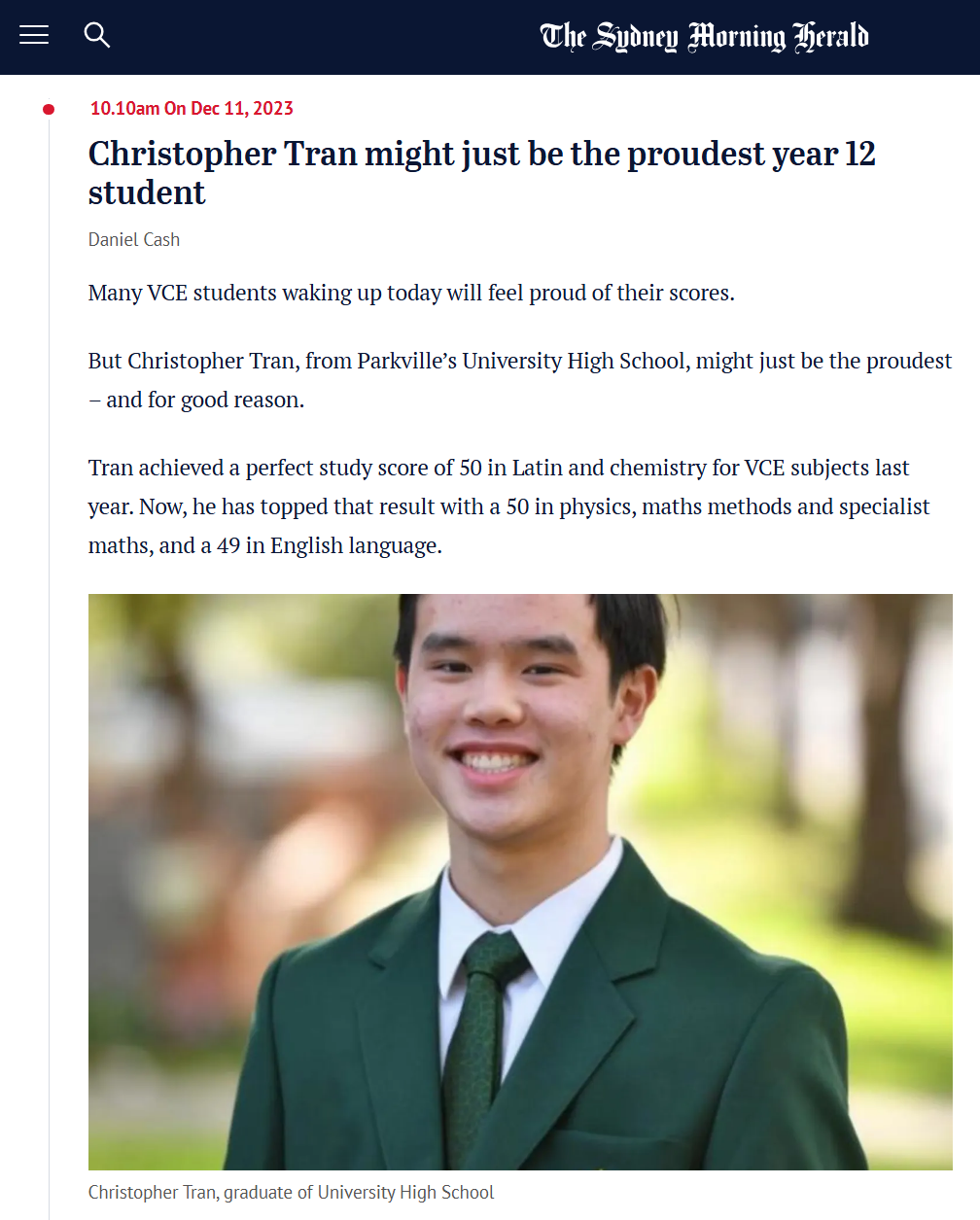 Portrait of Christopher Tran in a green school blazer and tie, smiling outdoors.