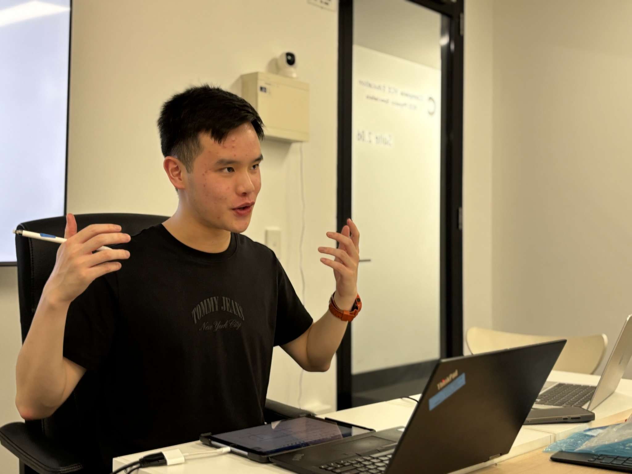 A VCE Maths Methods tutor helping students at an in-person VCE tutoring centre