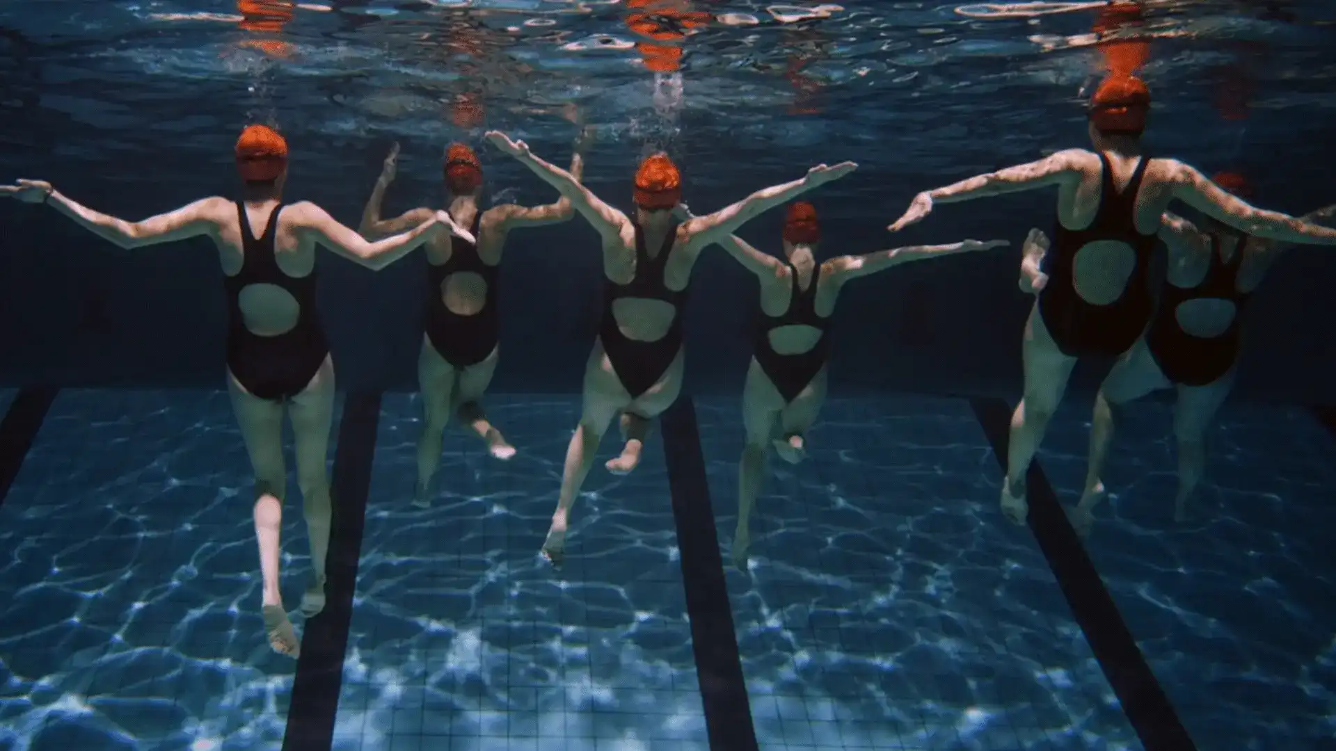 CBRE brand video — swimmers motion graphic still