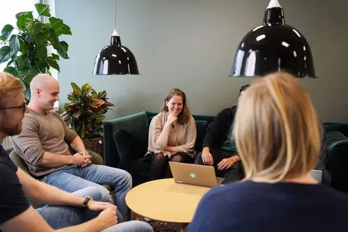 Refined employees sitting together and working.