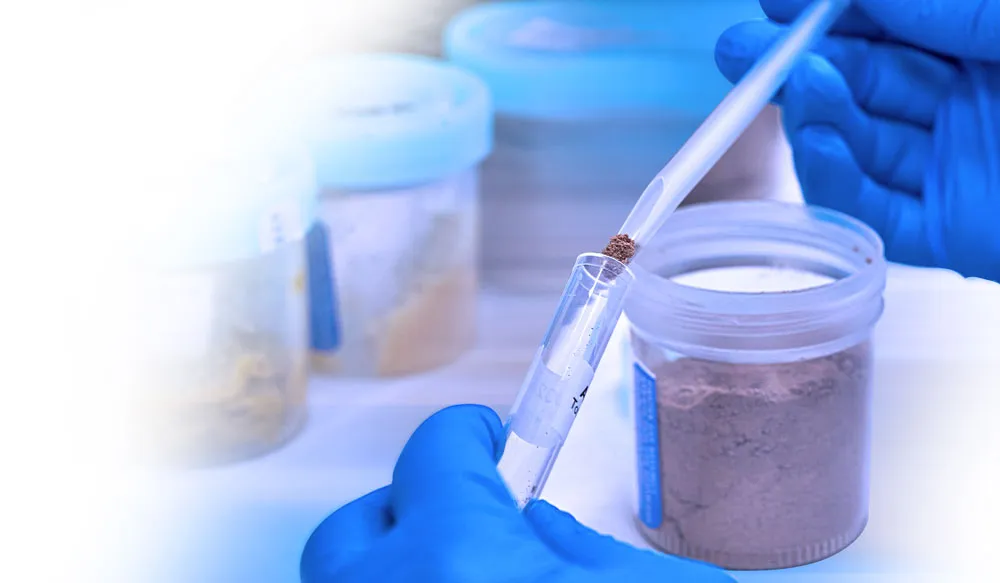 A CBD scientist getting samples into a test tube