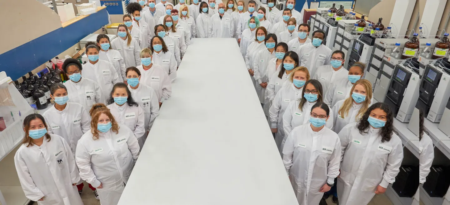 Team of lab experts in a group image