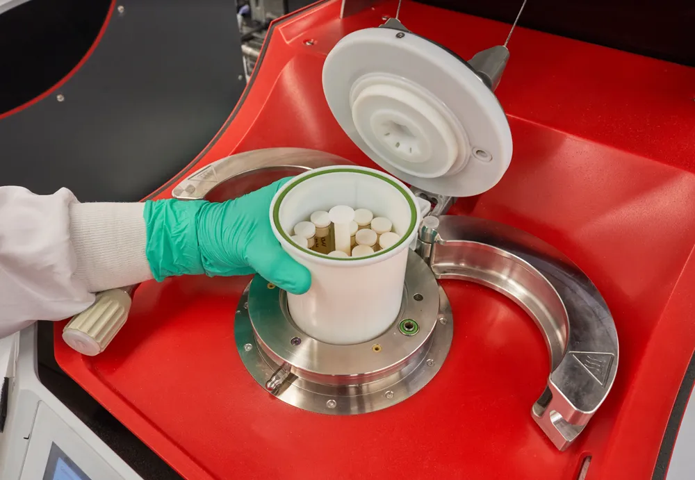 A scientist storing Cannibis testing tubes.