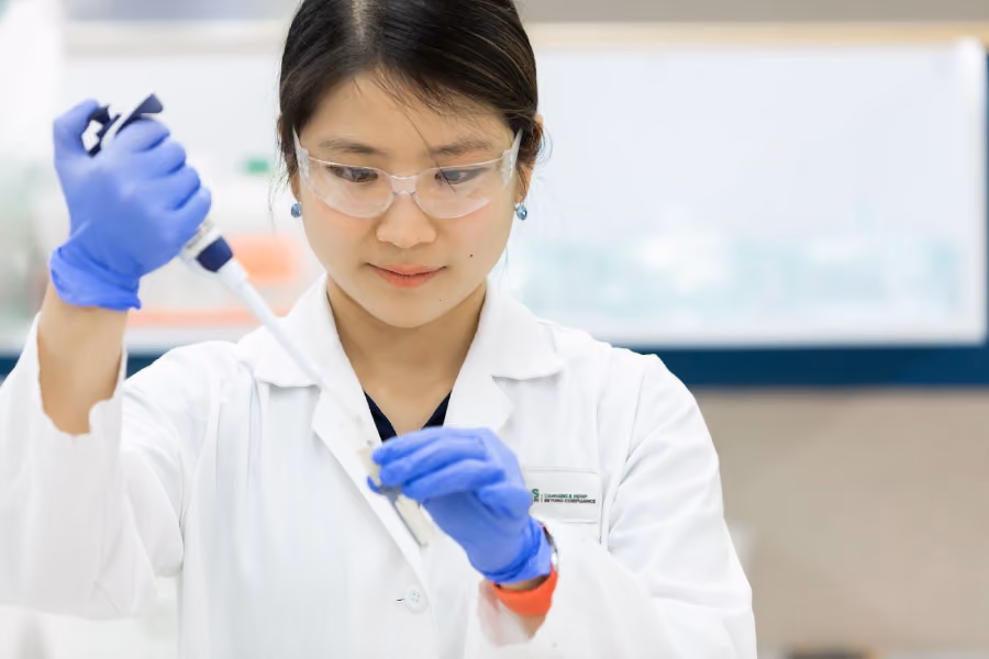A scientist taking out a Cannabis sample from the tube.
