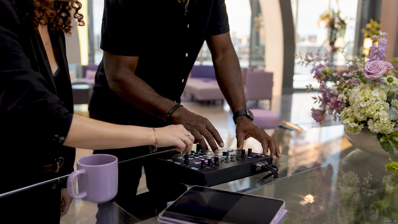 Hands adjusting plug-and-play AV controls