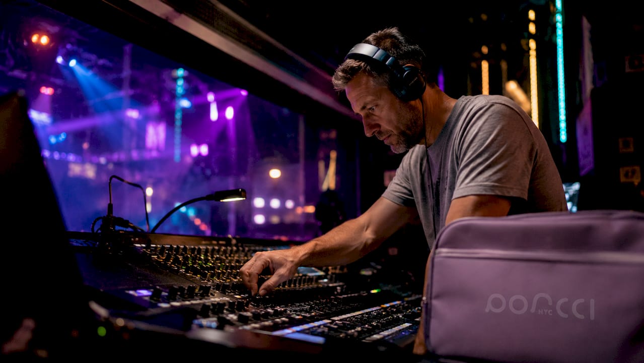 AV technician calibrating nightclub sound and lights