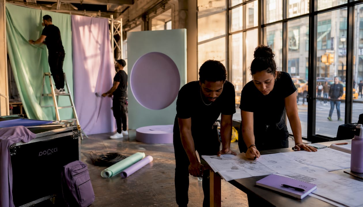 Technicians setting up brand activation event in NYC loft