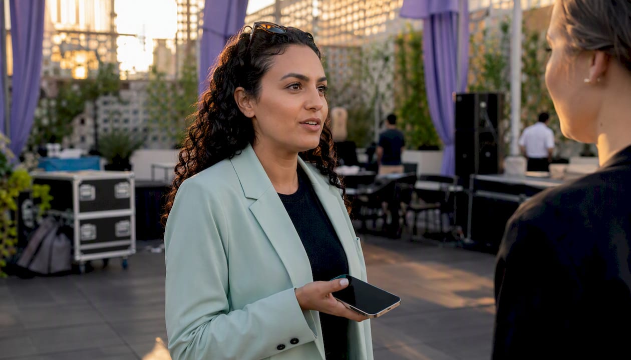 Close-up of transportation concierge using phone at event site