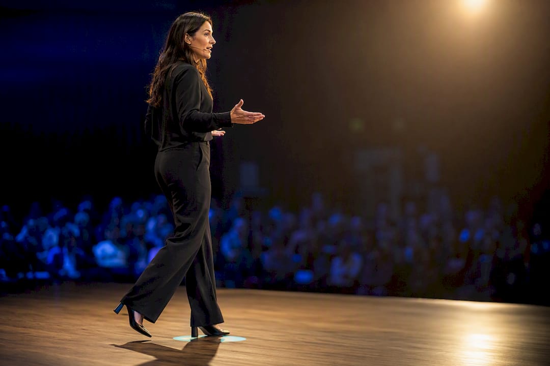 Active presenter wearing headset microphone
