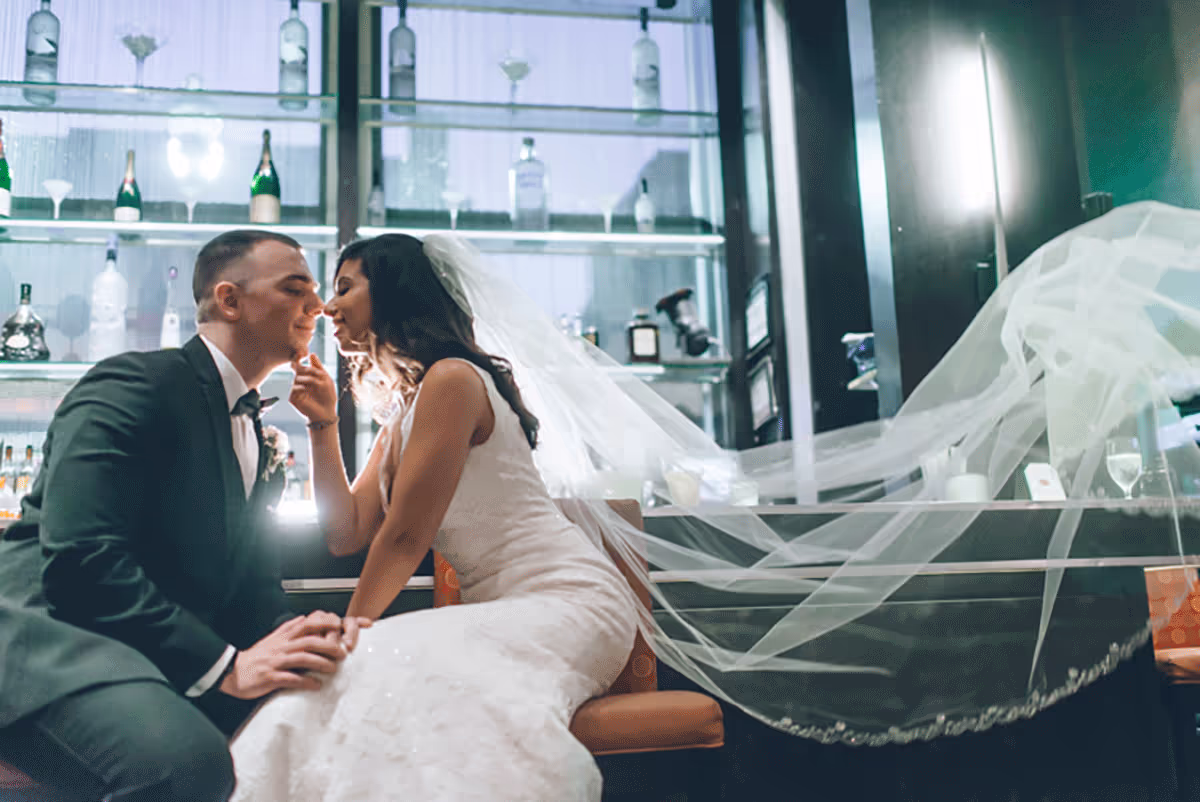 Husband and wife embracing at the bar