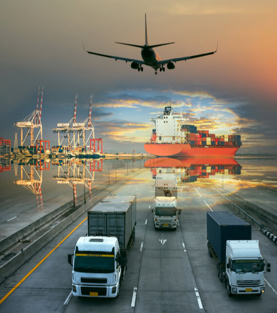Cargo ship, airplane, and trucks representing global logistics and transportation operations across air, sea, and land supply chains.
