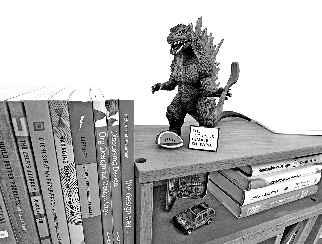 Godzilla sitting on my bookshelf
