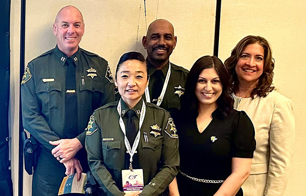 Group photo of members of the Orange County Sheriff's Department, Orange County Health Care Agency, and Concepts Forward Consulting
