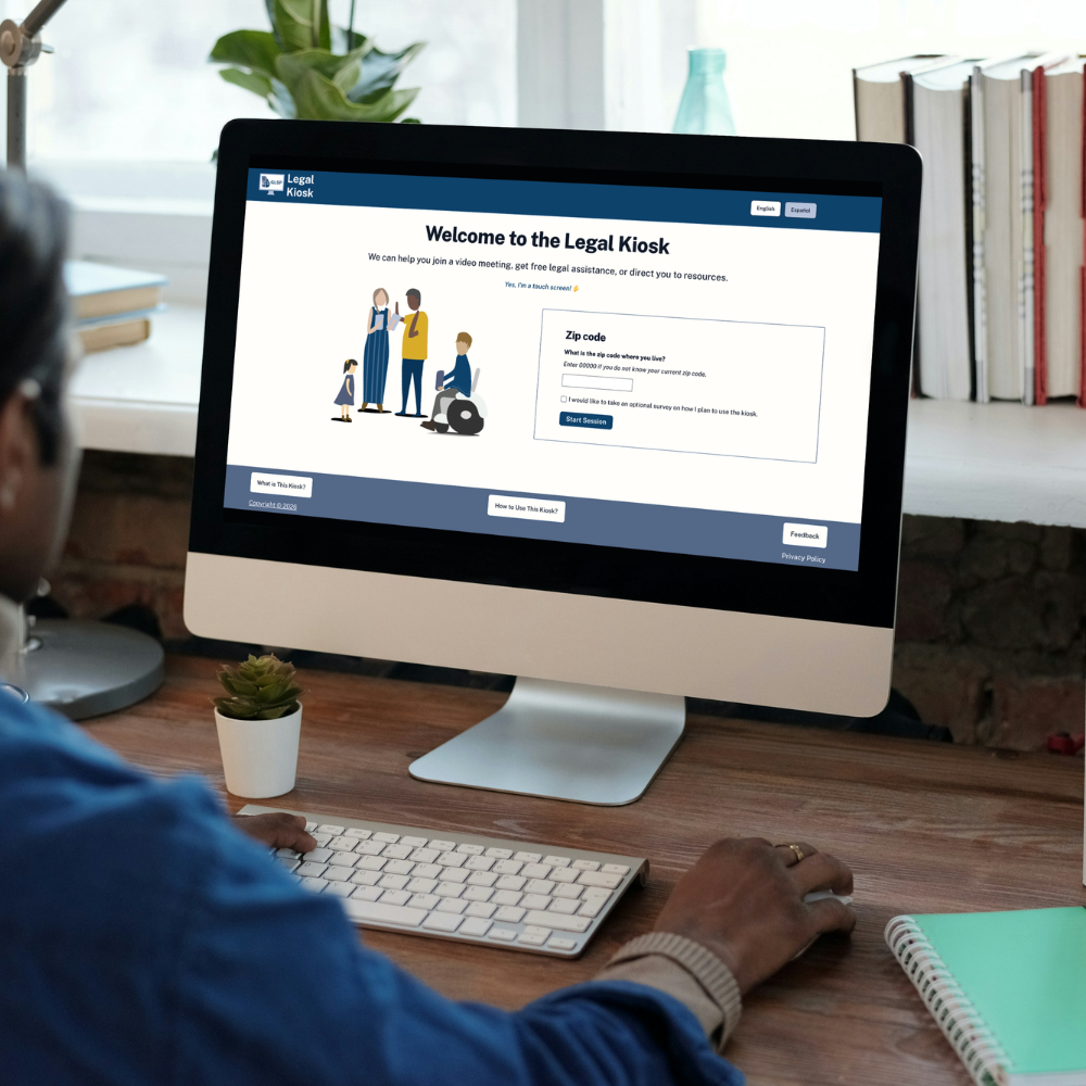 Photo of a desktop with the Legal Kiosk site on a desk