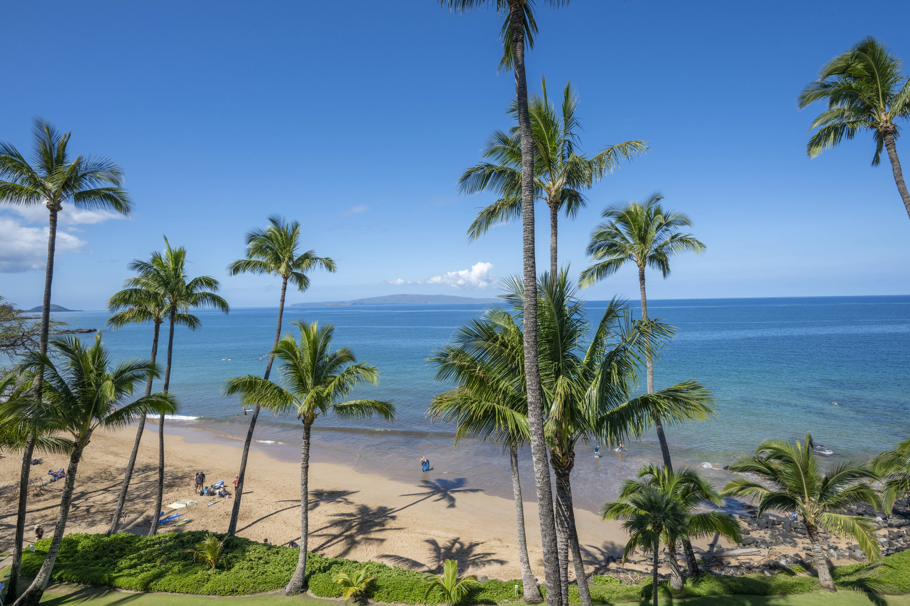 Calm morning at Kamaole Beach Park II in South Kihei, Maui, with golden sand and clear water