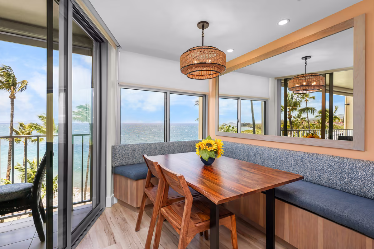 A dining nook beside sliding doors onto the lanai