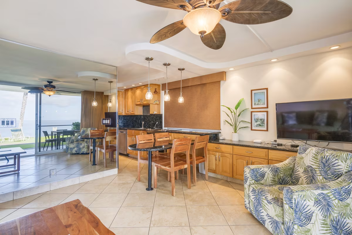 A full kitchen and living area in an oceanfront condominium