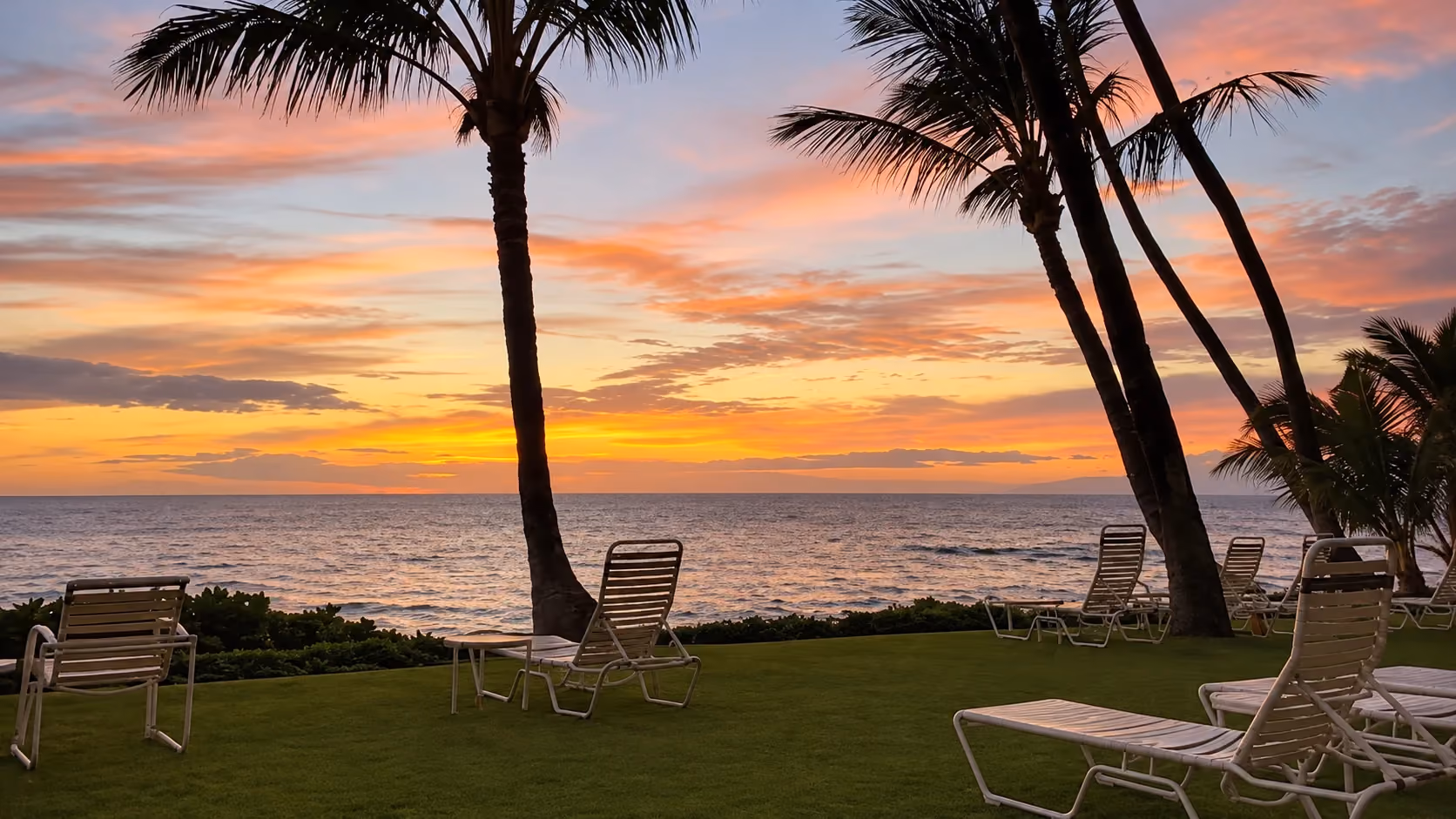Sunset from the oceanfront lawn at Hale Pau Hana.