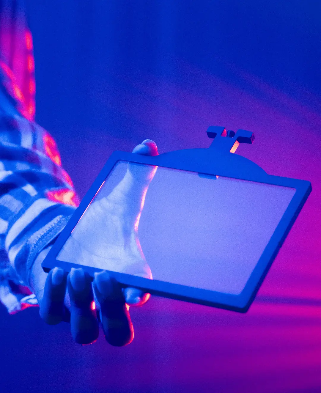Photography of woman holding light filter in left hand