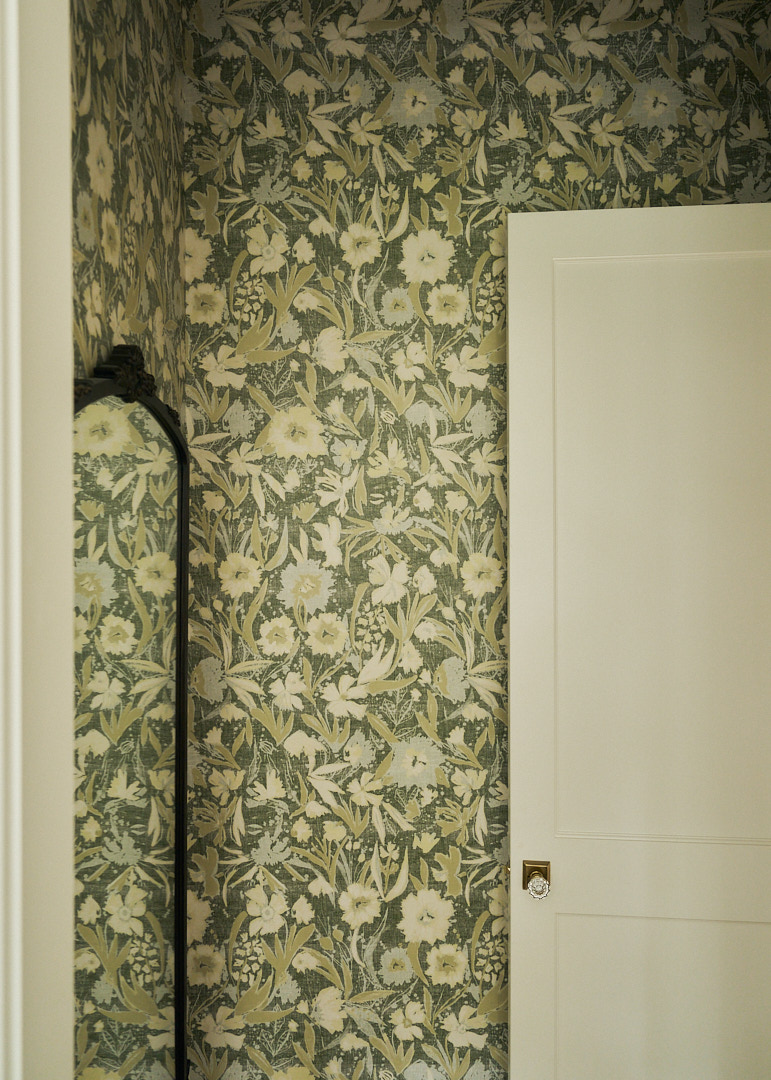 Botanical wallpaper with a vintage-inspired floral motif creating texture, depth, and timeless character in a luxury coastal residence.