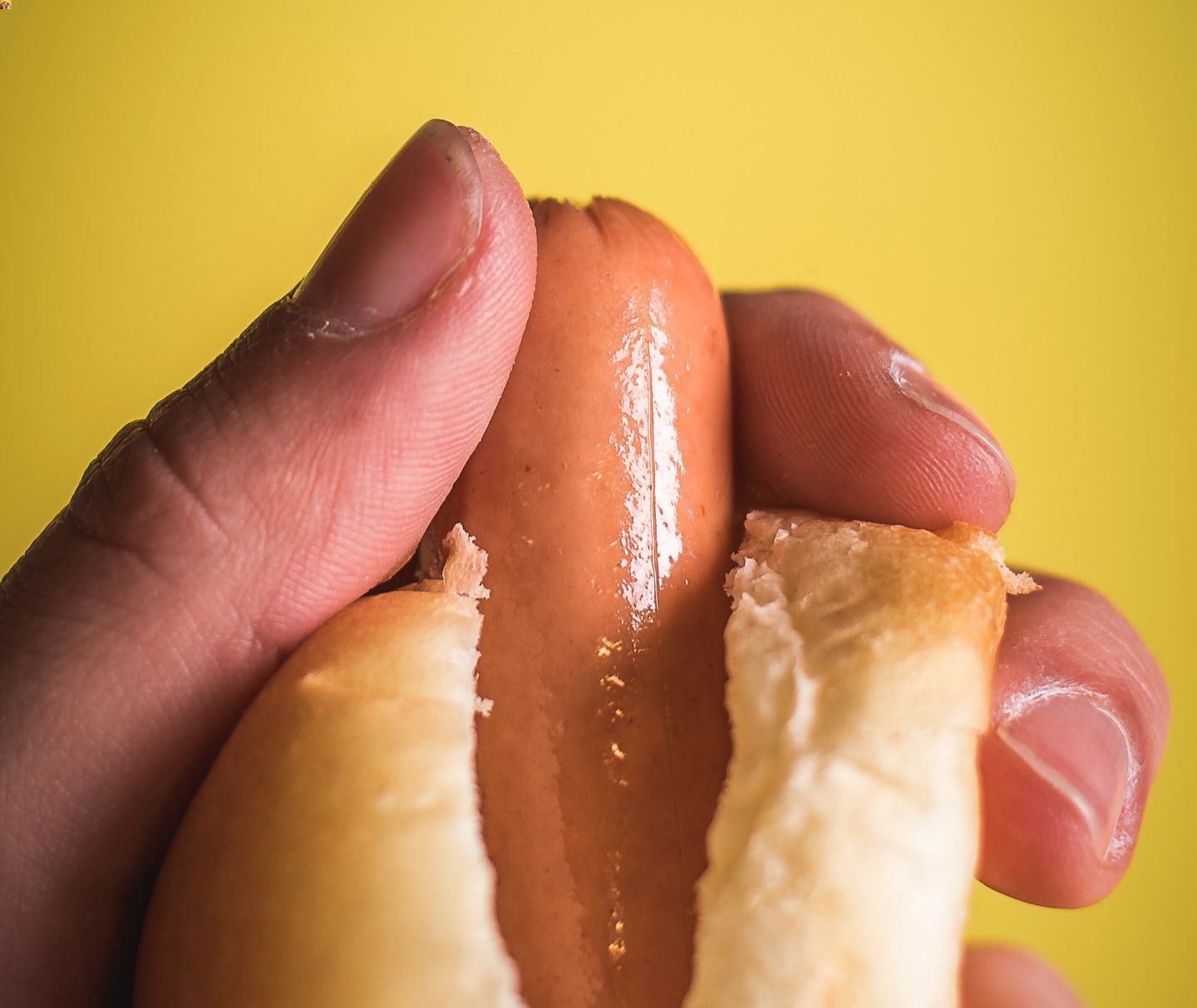 A man holding a hotdog