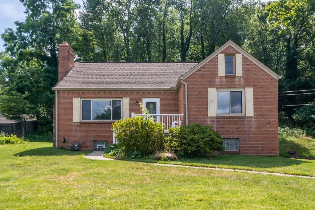 3 bedroom 2 bathroom home with grass yard