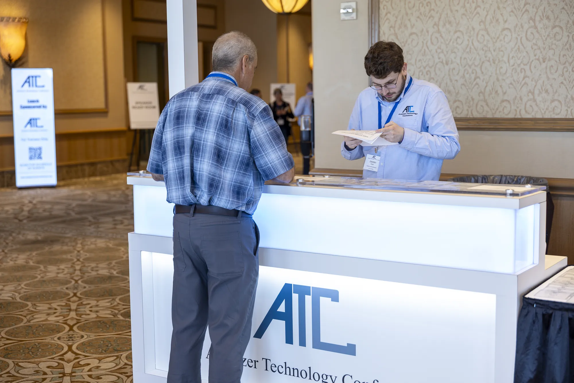 An attendee at the ATC registration desk