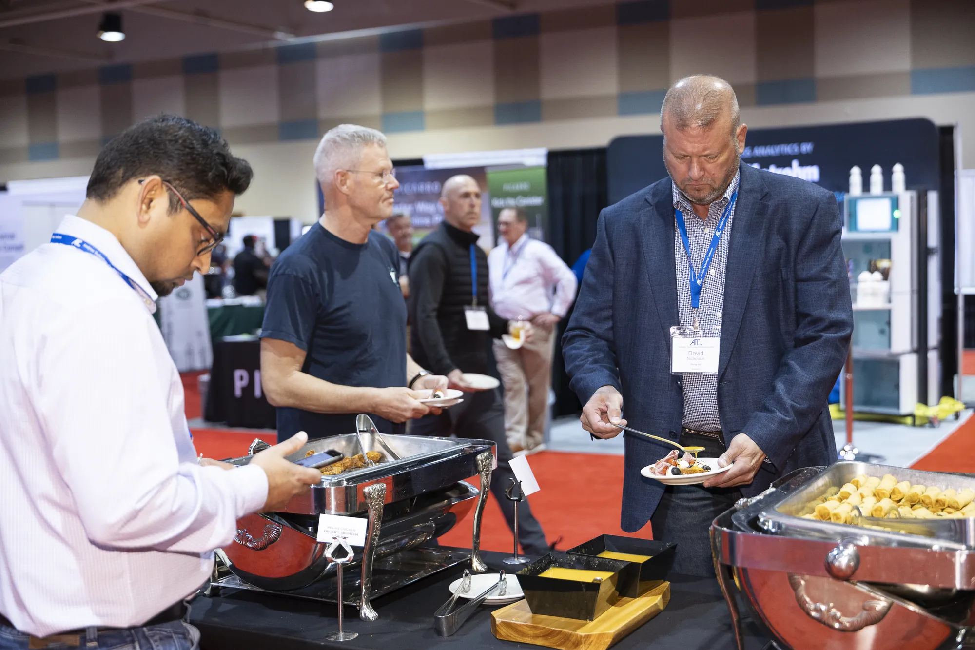 Attendees serving themselves at the lunch buffet