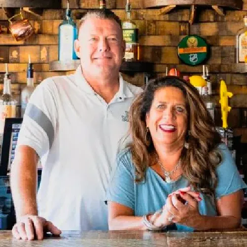 A photo of Wil Novak and his wife, the owners of Hail Mary's Food & Drink in Westlake, Ohio and a client of Popmenu