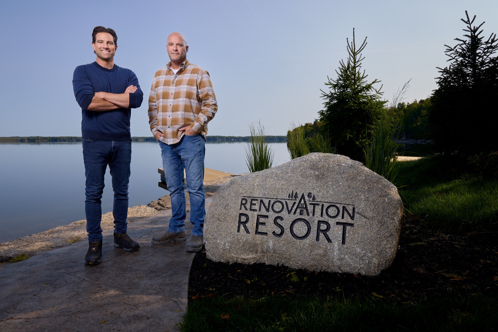 Renovation Resort hosts Scott and Bryan beside the show rock