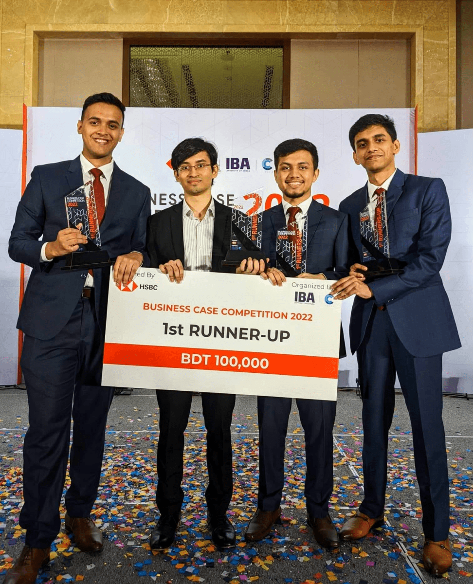four men receiving an award