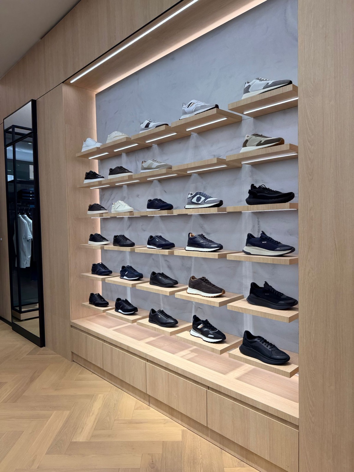 Backlit shoe shelving wall