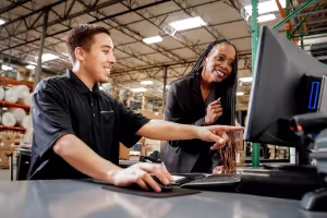 Logistics Experts looking at the computer