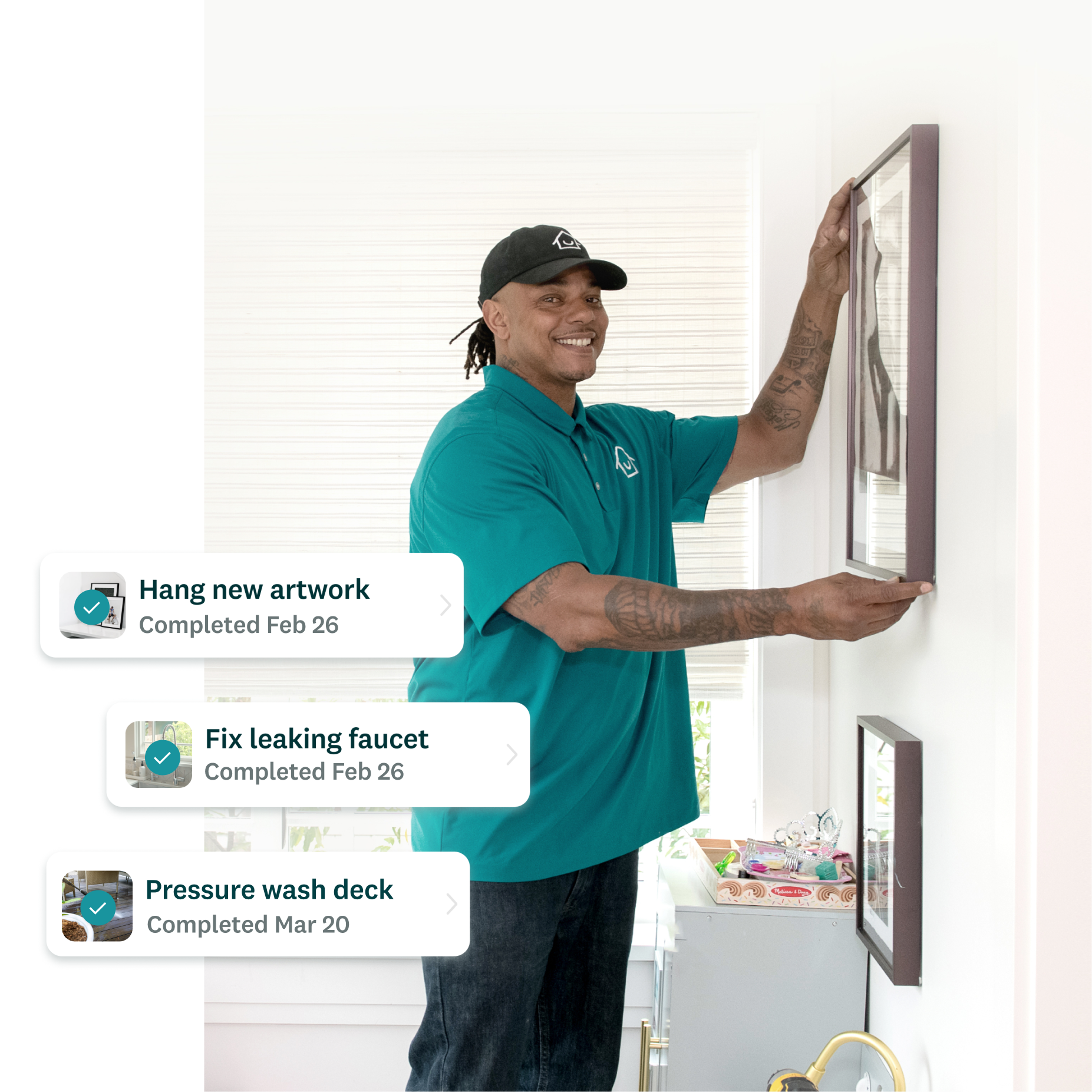 Honey Homes handyman hanging artwork with completed task list showing hang artwork, fix leaking faucet, and pressure wash deck